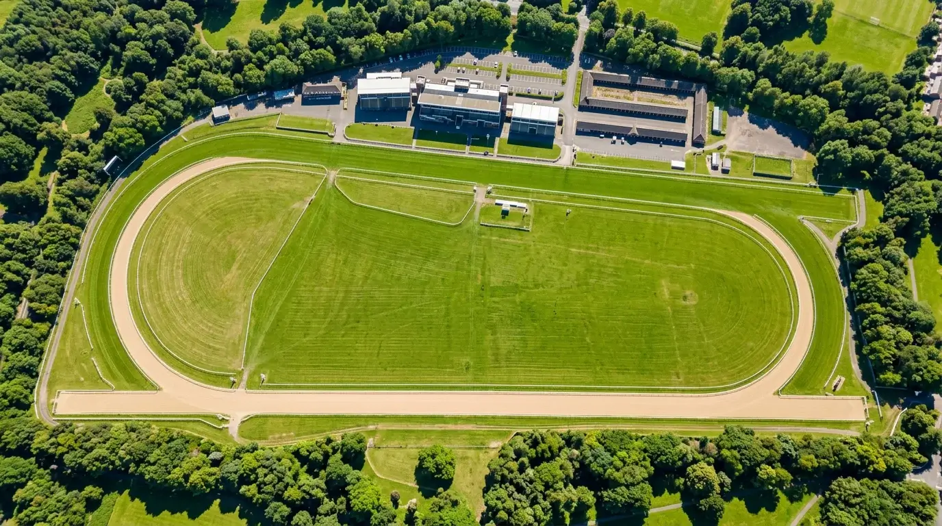 Aerial view of Gosforth Park Newcastle racecourse showing straight mile and oval circuit layout